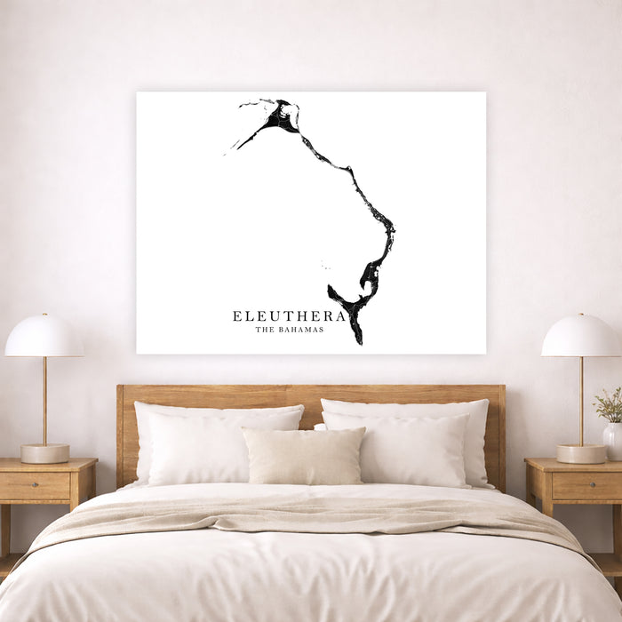 Map of Eleuthera, The Bahamas on a wall above a bed in a bedroom.