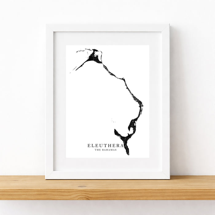 Framed black and white map of Eleuthera, The Bahamas on a white wall.