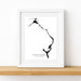 Framed black and white map of Eleuthera, The Bahamas on a white wall.