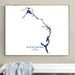 Framed map of Eleuthera, The Bahamas on a wall above a white bench.