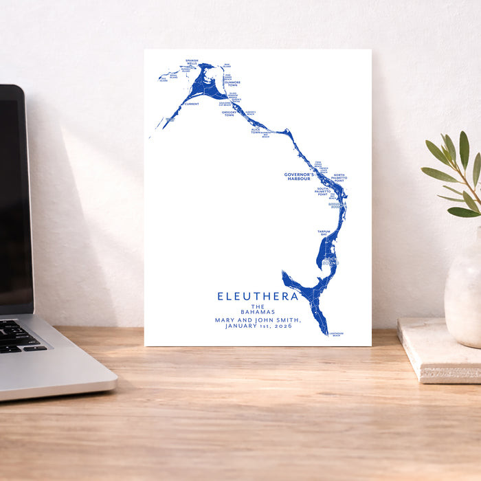 Map of Eleuthera, The Bahamas on a white background with a laptop and plant in the background.