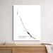 Map of Exumas, The Bahamas on a white wall above a wooden shelf.