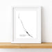 Framed map print of Exumas, The Bahamas on a white wall.
