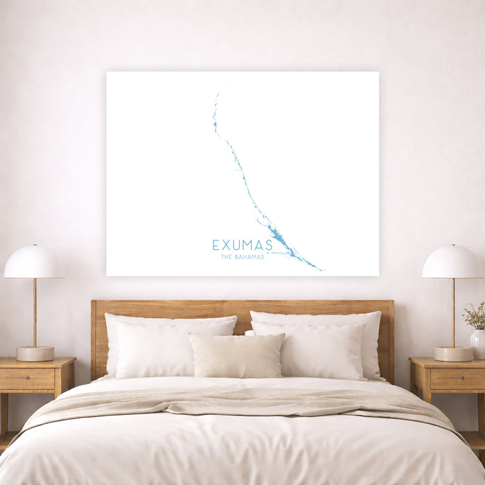 Bedroom with wooden headboard and 'Exumas' map on wall