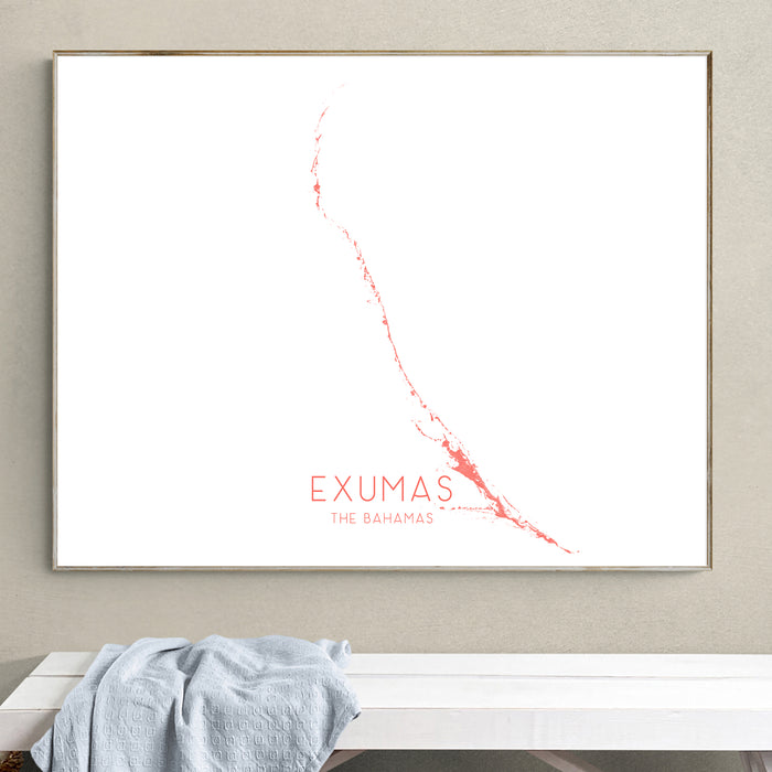 Framed map of Exumas, The Bahamas on a wall above a white bench.