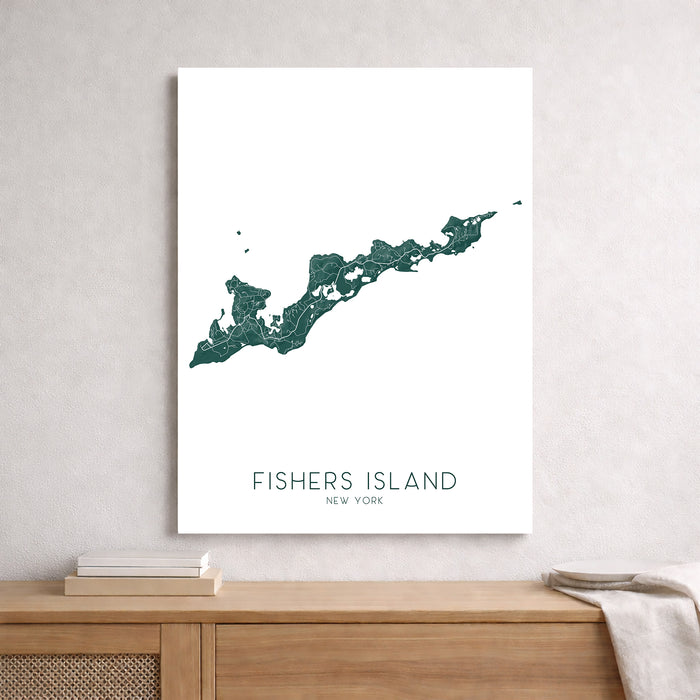 Map of Fishers Island, New York on a white wall above a wooden surface.