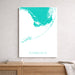 Framed map of the Florida Keys on a wall above a wooden shelf.