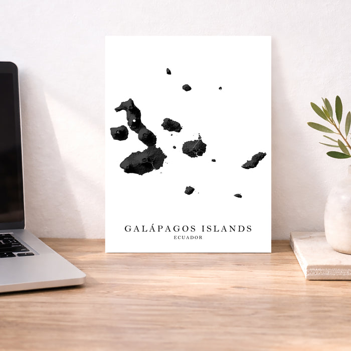 Map of Galápagos Islands on a white background displayed on a desk.