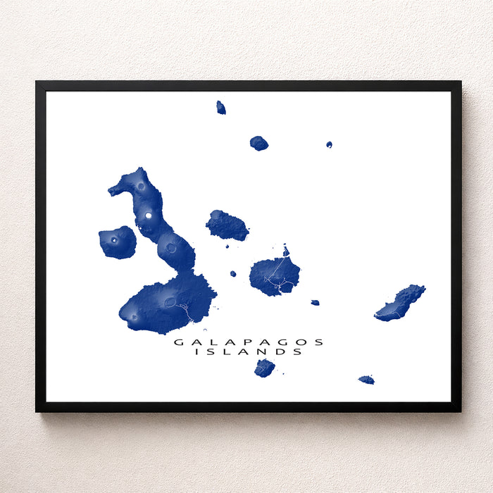Framed map of the Galapagos Islands on a white wall