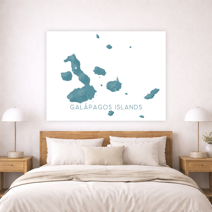 Bedroom with a map of the Galapagos Islands on the wall above a bed.