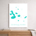 Map of Galápagos Islands on a white background, framed and leaning against a wall.