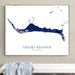 Framed map of Grand Bahama on a wall above a white bench.