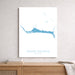 Map of Grand Bahama on a white wall above a wooden shelf.