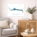 Living room with a gray sofa, wooden cabinet, and decorative items.