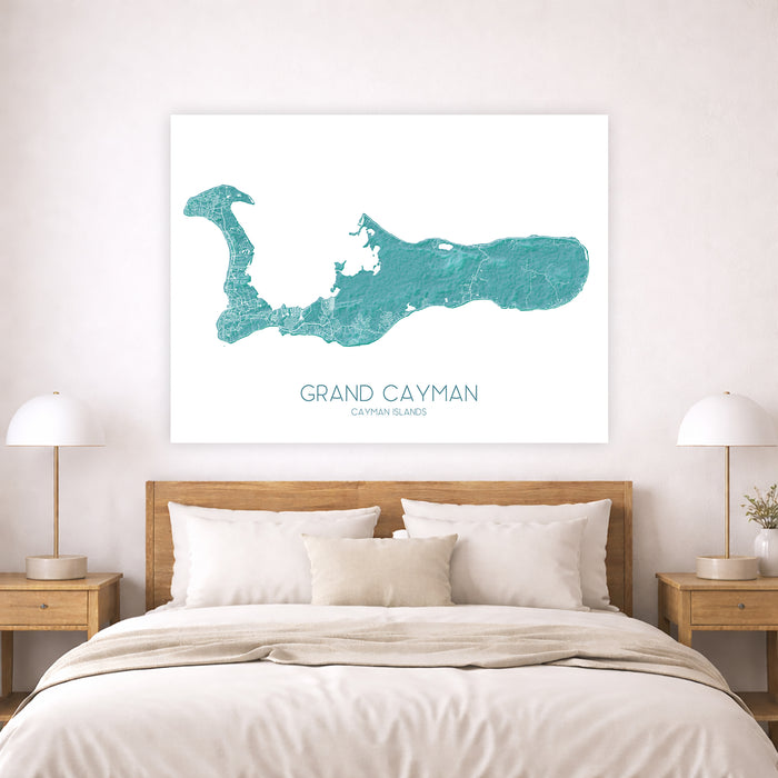 Map of Grand Cayman on a wall above a bed in a bedroom.