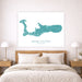 Map of Grand Cayman on a wall above a bed in a bedroom.