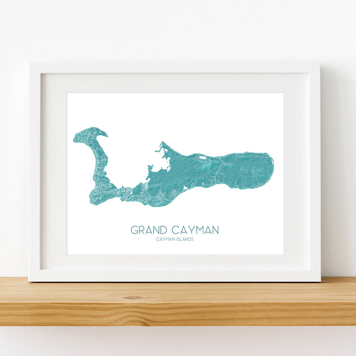 Framed map of Grand Cayman on a white wall