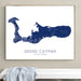 Framed map of Grand Cayman on a wall above a bench.