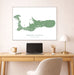Map of Grand Cayman on a wall above a desk with a laptop and lamp.