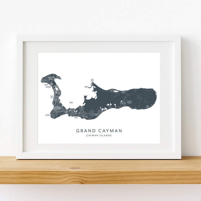 Framed map of Grand Cayman on a white wall