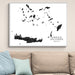 Framed map of Greek Islands on a wall above a sofa