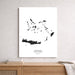 Framed map of Greek Islands on a wall above a wooden shelf.