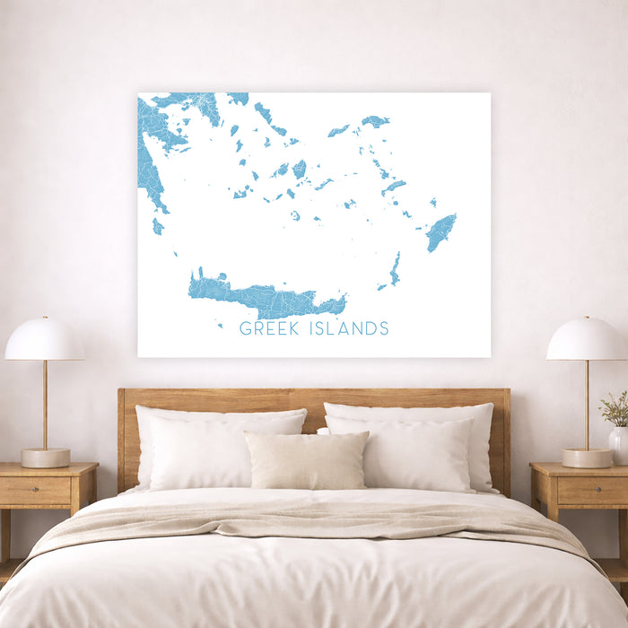 Map of Greek Islands on a wall above a bed in a bedroom.