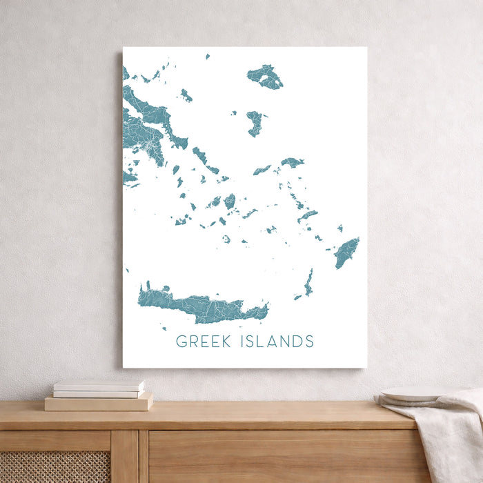 Map of Greek Islands on a white wall above a wooden shelf.