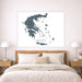 Map of Greece on a wall above a bed in a bedroom setting