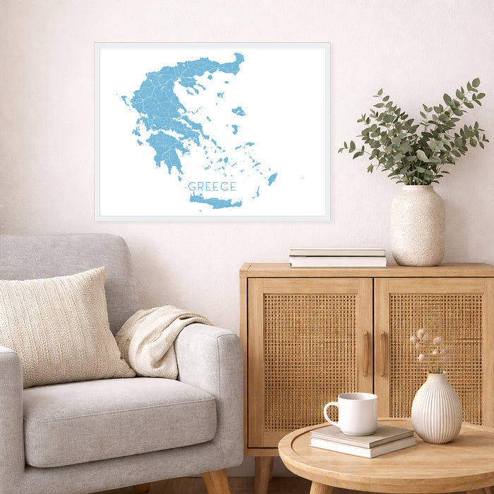 Living room with a gray sofa, wooden cabinet, and framed map of Greece on the wall.