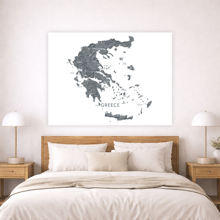 Map of Greece on a wall above a bed in a bedroom