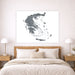 Map of Greece on a wall above a bed in a bedroom