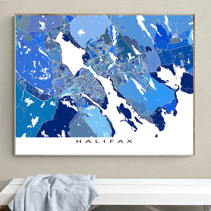 Framed map of Halifax on a wall above a white surface.