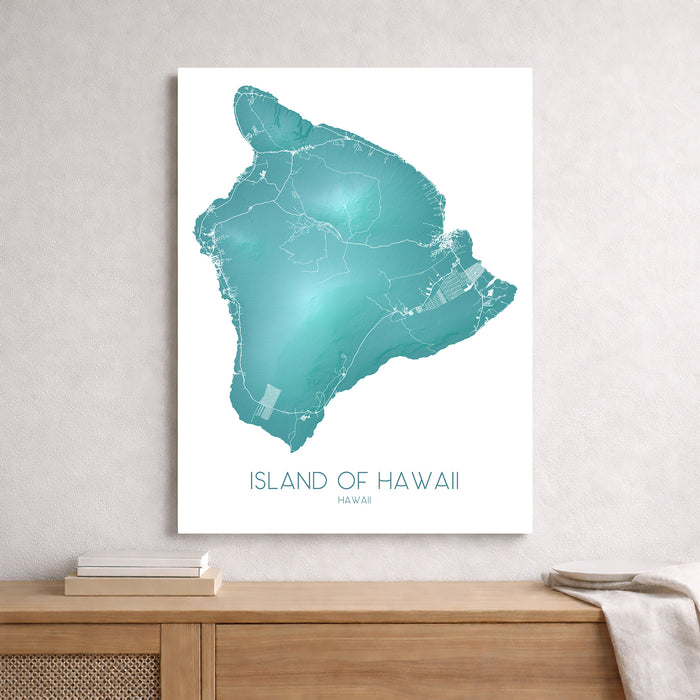 Map of the Island of Hawaii on a white background, framed above a wooden surface.