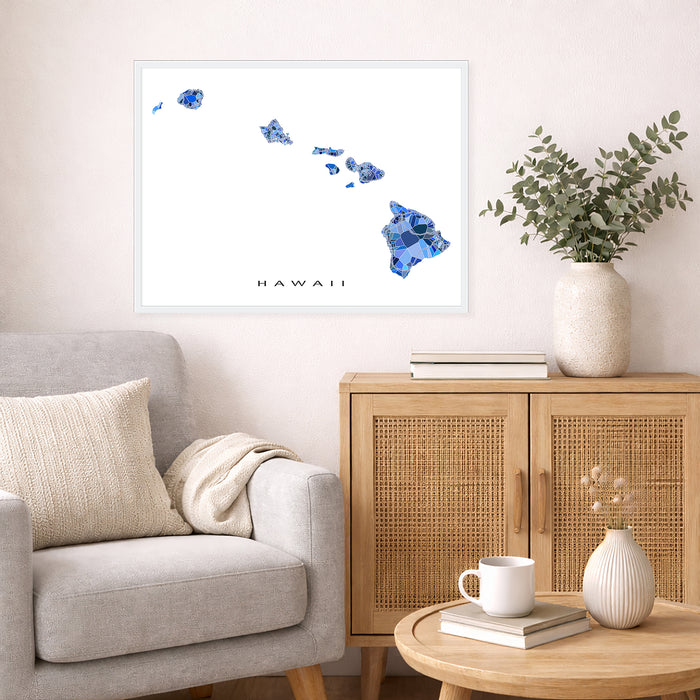 Living room with a gray sofa, wooden cabinet, and decorative items including a map of Hawaii.