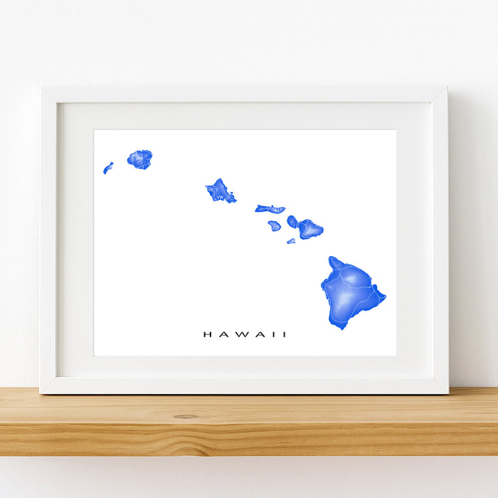 Framed artwork of a blue watercolor map of Hawaii on a white background