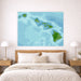 Map of Hawaii on a wall above a bed in a bedroom