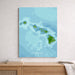 Canvas print of Hawaii with blue and green colors, displayed on a wooden surface.