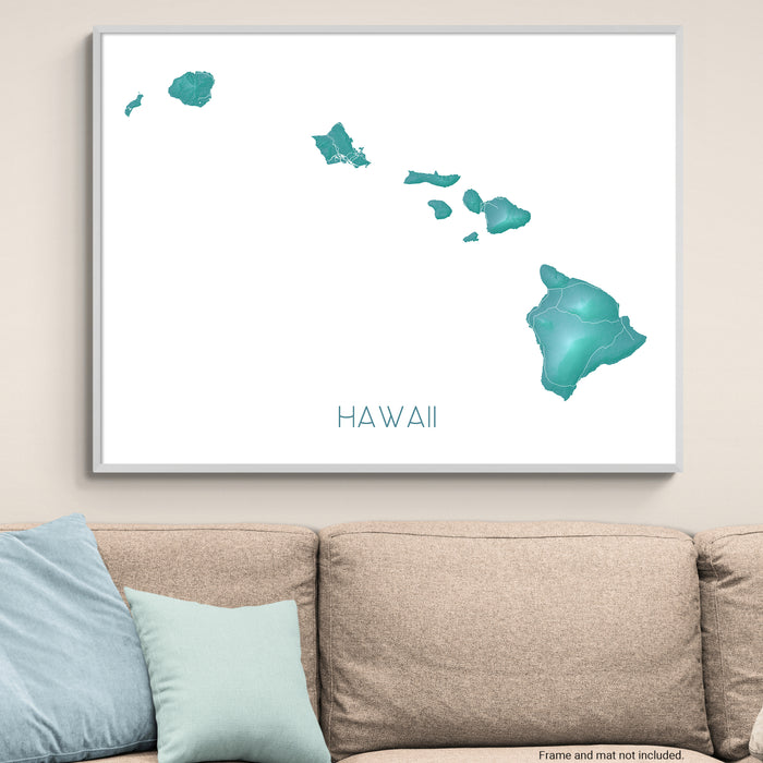 Framed map of Hawaii on a wall above a beige sofa with light blue pillows.