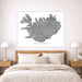 Map of Iceland on a wall above a bed in a bedroom setting