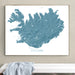 Framed map of Iceland on a wall above a white bench.