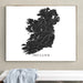 Map of Ireland framed on a wall above a white bench.