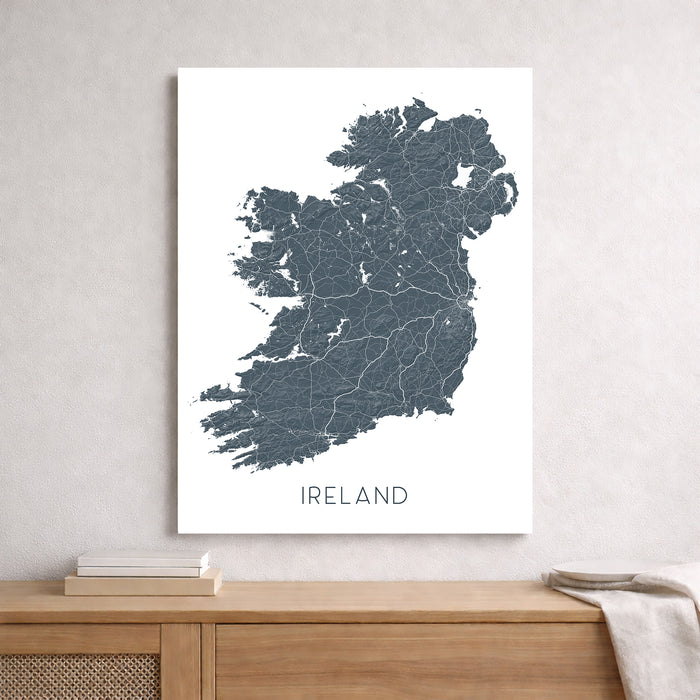 Map of Ireland on a white background above a wooden surface