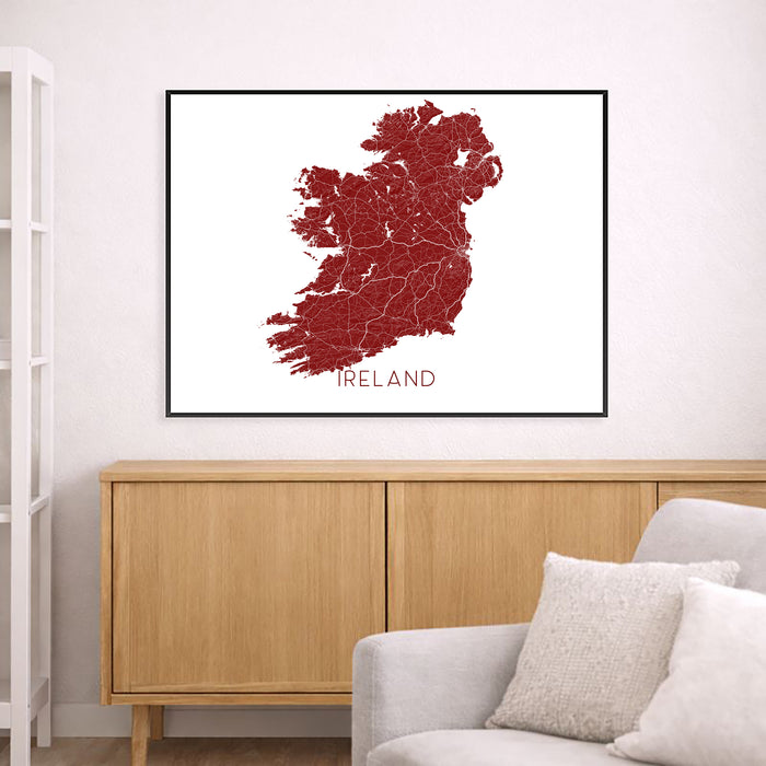 Map of Ireland framed on a wall above a wooden cabinet and sofa.