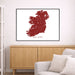 Map of Ireland framed on a wall above a wooden cabinet and sofa.
