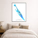 Framed map of Isla Mujeres on a wall above a bed.