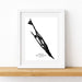 Framed black and white silhouette map art print of Isla Mujeres Mexico on a white background