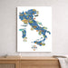 Map of Italy on a wall above a wooden surface