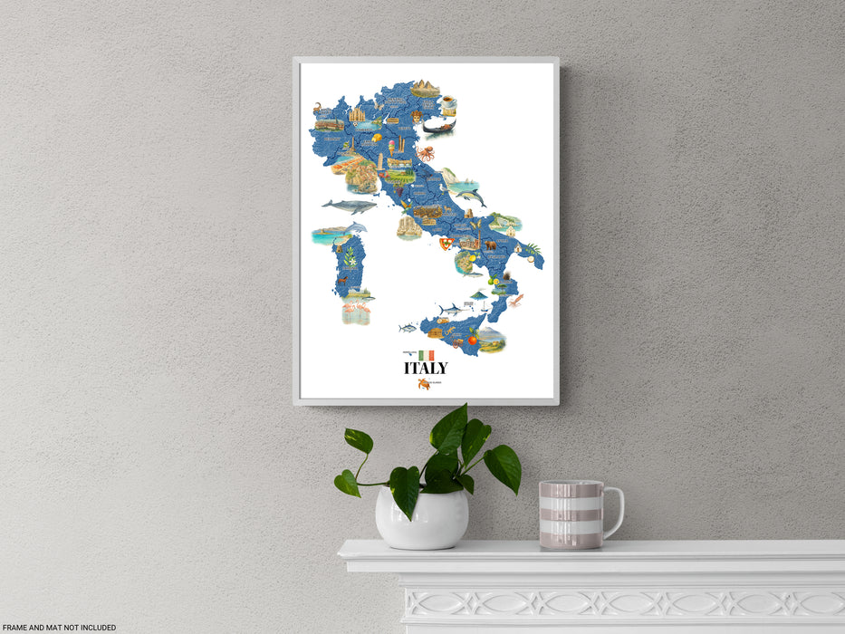 Framed map of Italy on a gray wall with a plant and mug below.