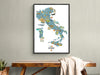 Framed map of Italy on a wall above a wooden table.